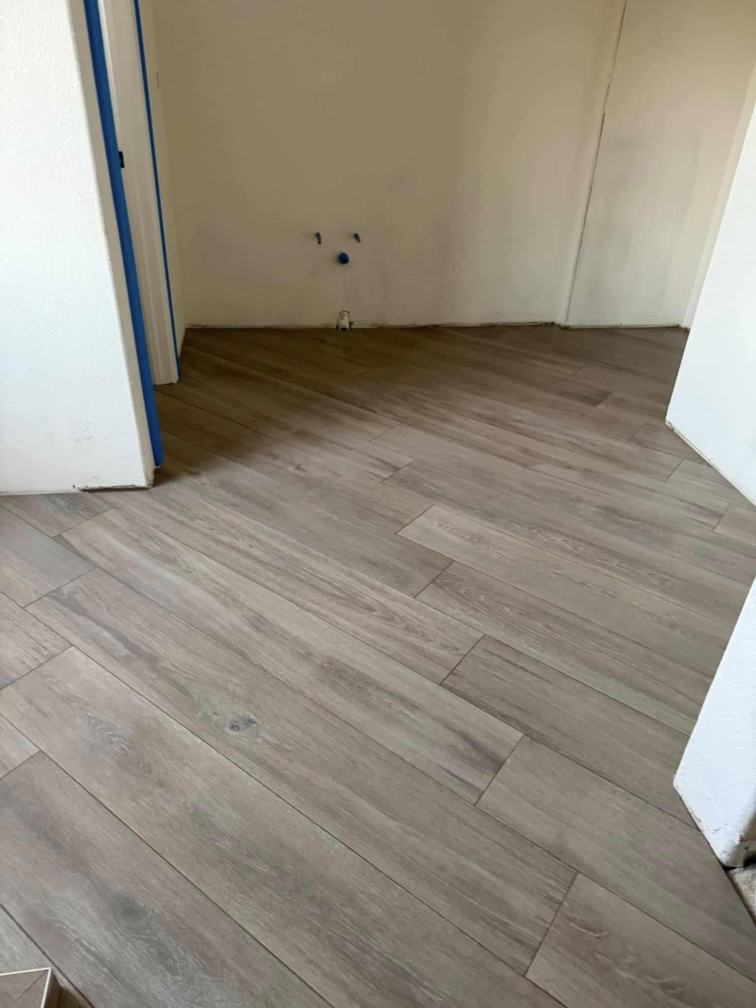 Friendly professional handyman holding an adjustable wrench, ready to perform home repair services in San Francisco