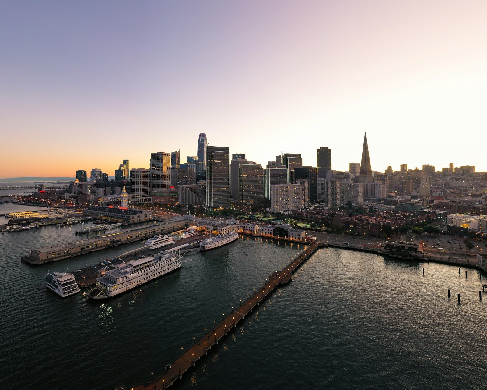 San Francisco skyline and waterfront piers at dusk